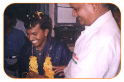 Mr. N Bitra Receiving A memento from Pinnamaneni Venkateswara Rao, Minister Technical Education, on the occasion of 56th Independence Day (15th August 2003). Bitra Net Pvt. Ltd., has donated two letest configuration computers to a School located in Puttagunta (Krishna Dist, Andhra Pradesh)